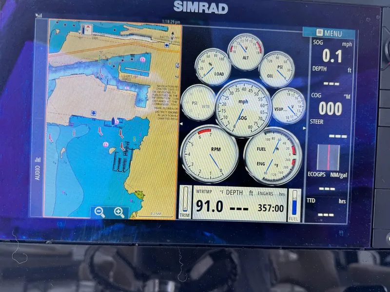 Slide: The Image of Simrad navigation display on 2017 Sportsman Masters 267 Bay Boat showing map and gauges. - 23