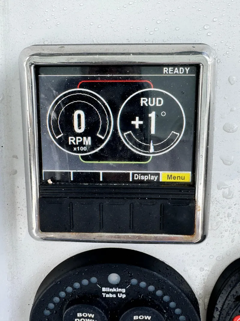 Slide: The Image of Control panel display on 2017 Sportsman Masters 267 Bay Boat showing RPM and rudder angle. - 28