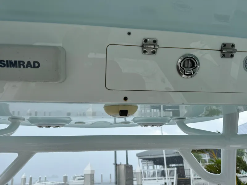 Slide: The Image of 2017 Sportsman Masters 267 Bay Boat dashboard with Simrad equipment and storage compartments. - 29