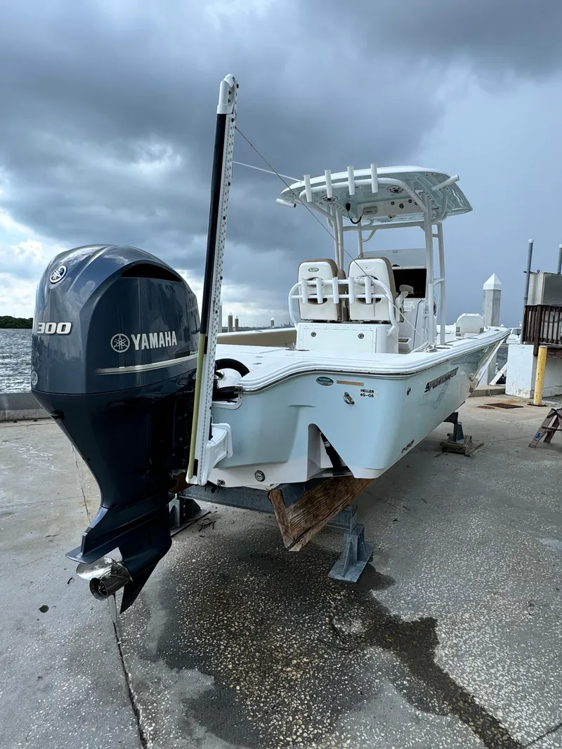 Slide: The Image of 2017 Sportsman Masters 267 Bay Boat with Yamaha engine, docked under cloudy skies. - 3