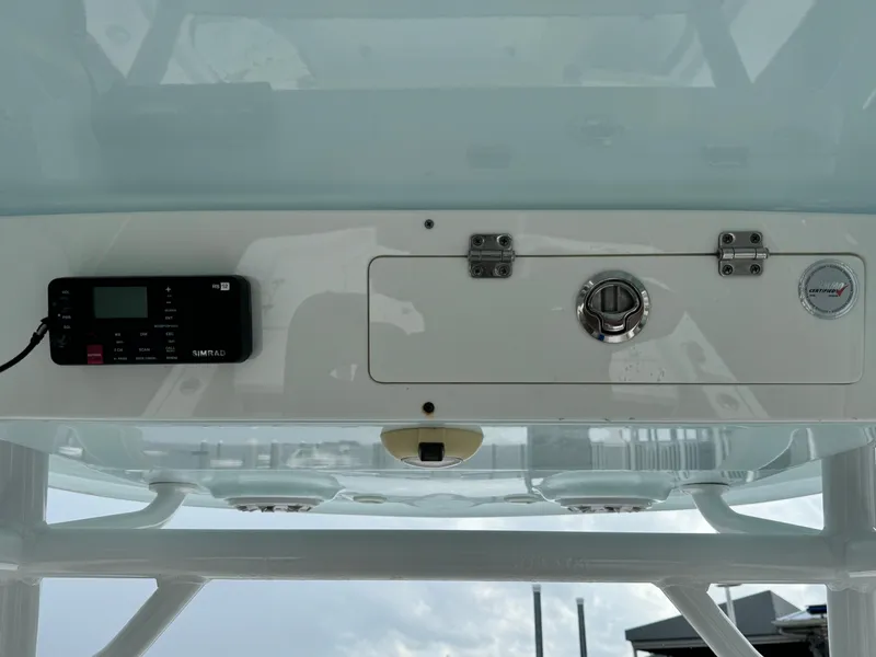 Slide: The Image of 2017 Sportsman Masters 267 Bay Boat console with electronic controls and storage compartment. - 30