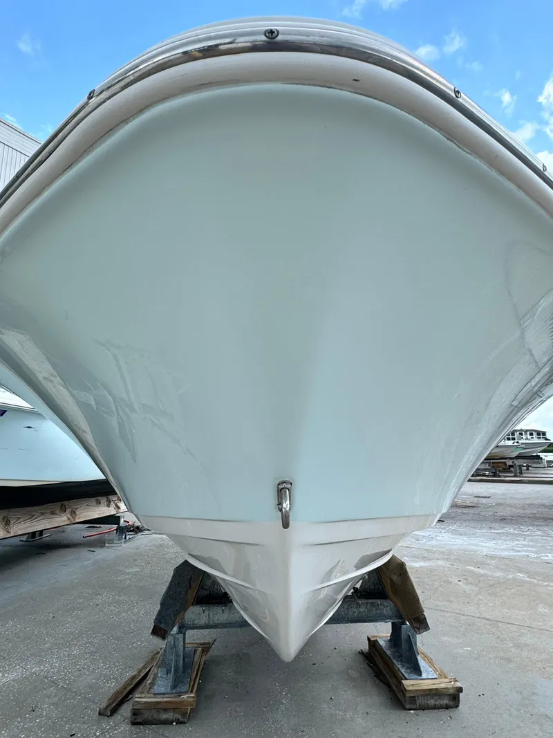 Slide: The Image of 2017 Sportsman Masters 267 Bay Boat, front view, on a stand, outdoors. - 4