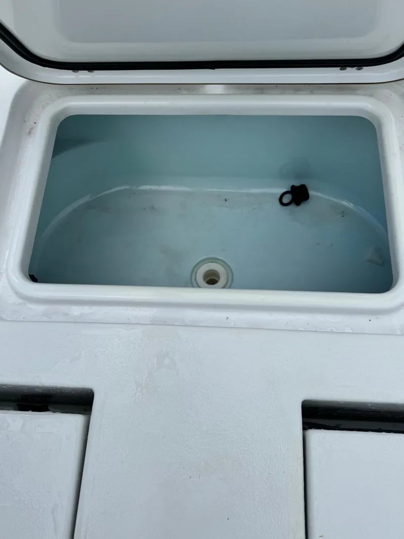 Slide: The Image of Open storage compartment on 2017 Sportsman Masters 267 Bay Boat. - 8