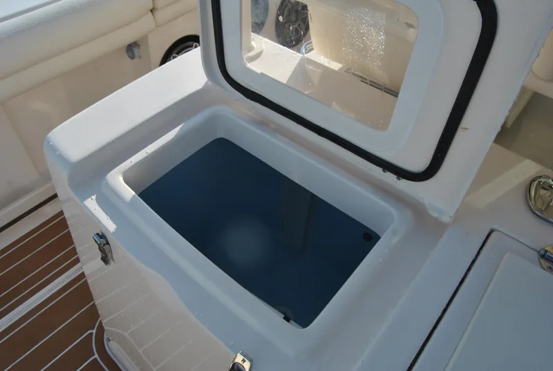 Slide: The Image of Livewell on 2018 Grady-White Canyon 376 boat, open lid, white interior. - 12