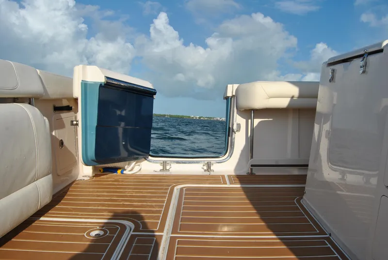Slide: The Image of 2018 Grady-White Canyon 376 boat deck with ocean view and clear sky. - 13