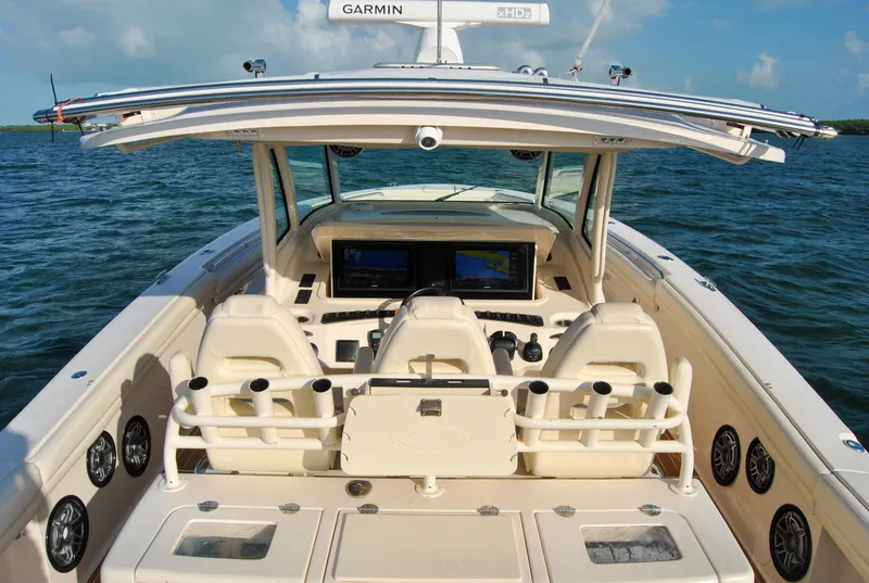 Slide: The Image of 2018 Grady-White Canyon 376 boat interior with helm, seating, and Garmin electronics. - 29
