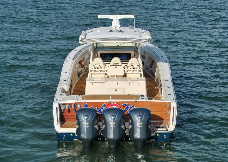 Slide: The Image of 2018 Grady-White Canyon 376 boat with triple outboard engines on water. - 32