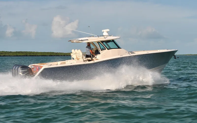 Slide: The Image of 2018 Grady-White Canyon 376 boat cruising on open water. - 38