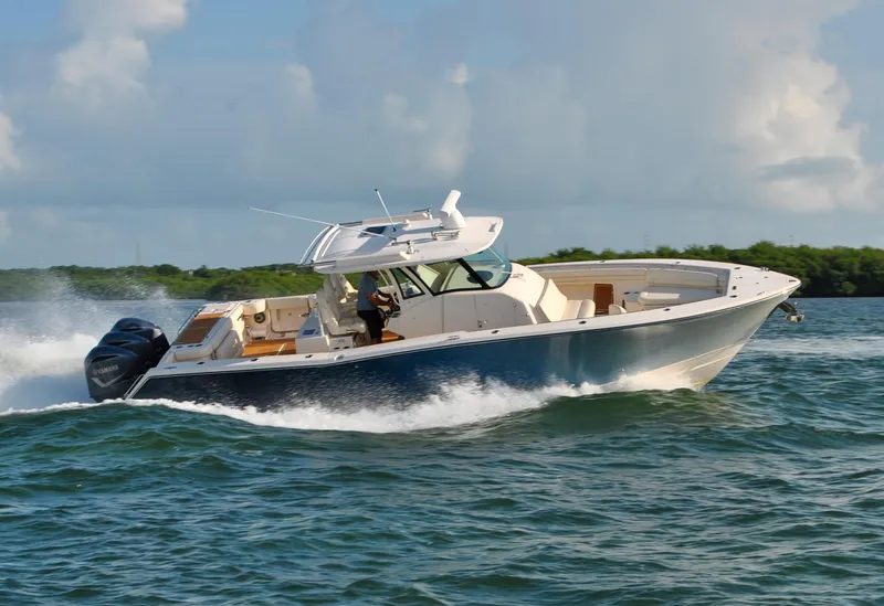 Slide: The Image of 2018 Grady-White Canyon 376 boat cruising on open water. - 41