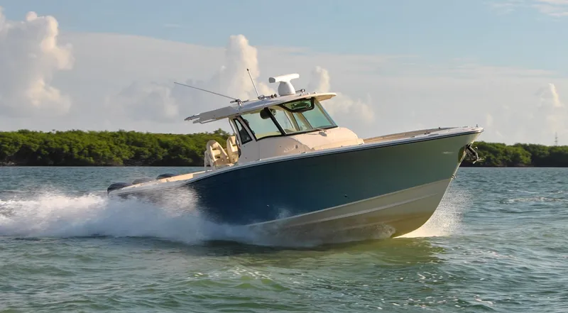 Slide: The Image of 2018 Grady-White Canyon 376 boat cruising on water under clear sky. - 42