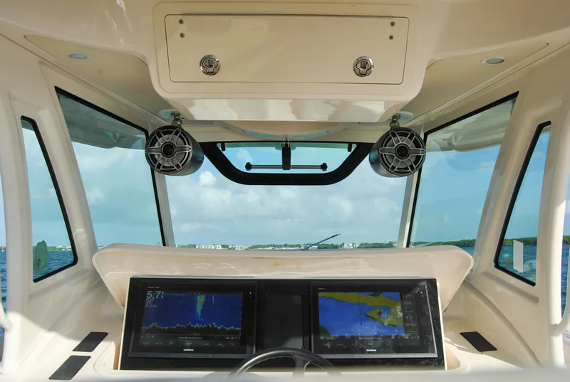 Slide: The Image of 2018 Grady-White Canyon 376 helm with dual navigation screens and ocean view. - 5