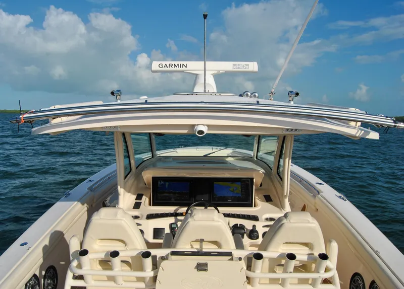 Slide: The Image of 2018 Grady-White Canyon 376 boat dashboard with Garmin electronics on open water. - 6