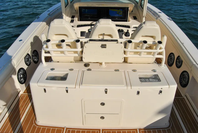 Slide: The Image of 2018 Grady-White Canyon 376 boat interior with helm, seating, and storage compartments. - 8