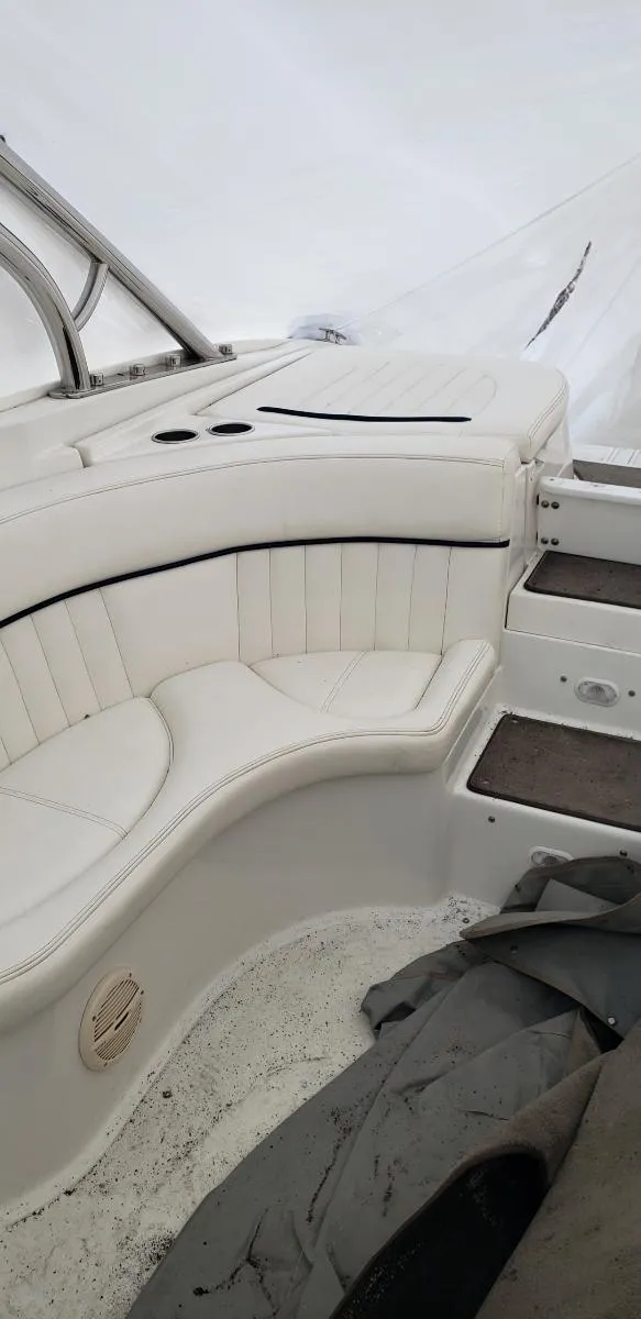 Slide: The Image of 2005 Cobalt 282 boat interior with white seating and sleek design. - 12
