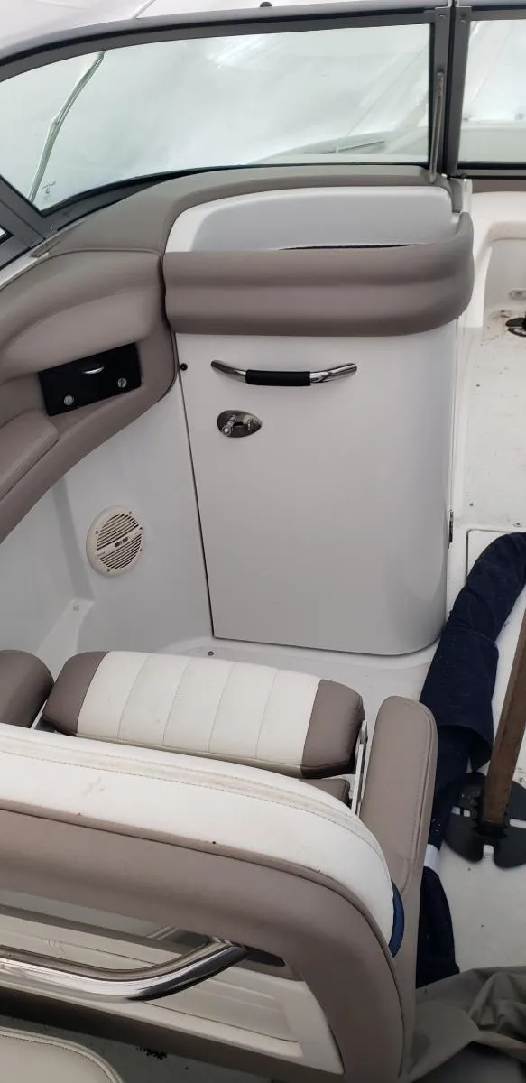 Slide: The Image of 2005 Cobalt 282 boat interior with beige and white seating. - 5