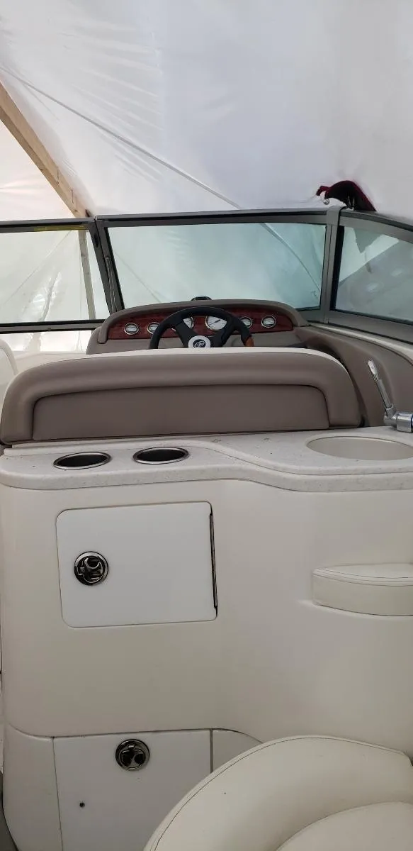 Slide: The Image of 2005 Cobalt 282 boat interior with steering wheel and dashboard. - 8