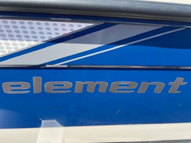 Slide: The Image of 2025 Bayliner Element E18 boat with blue and white design details. - 2