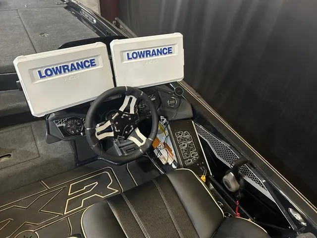 Slide: The Image of 2023 Skeeter FXR21 boat cockpit with dual Lowrance displays and Yamaha 250 "SHO" controls. - 12