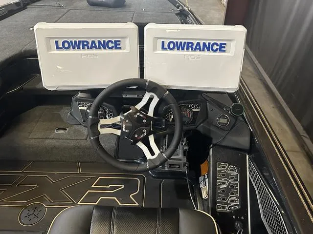 Slide: The Image of 2023 Skeeter FXR21 boat dashboard with dual Lowrance HDS displays and Yamaha controls. - 13