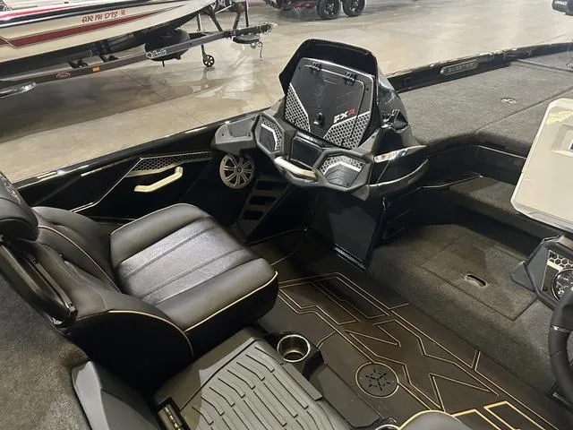 Slide: The Image of 2023 Skeeter FXR21 boat interior with Yamaha 250 "SHO" engine, featuring sleek black seating and dashboard. - 14