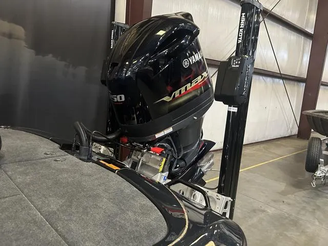 Slide: The Image of 2023 Skeeter FXR21 with Yamaha 250 SHO outboard motor in a garage. - 6