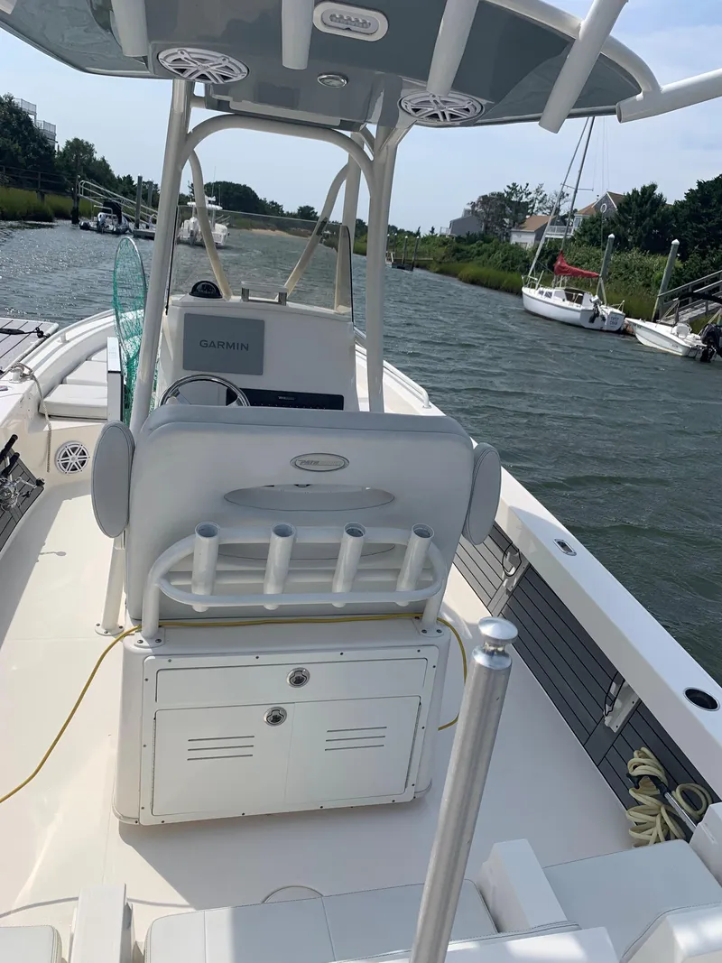 Slide: The Image of 2021 Pathfinder 2600 TRS boat interior with Garmin equipment on a sunny day. - 10