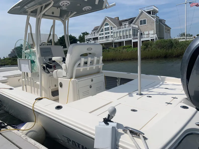 Slide: The Image of 2021 Pathfinder 2600 TRS boat docked near waterfront home. - 19