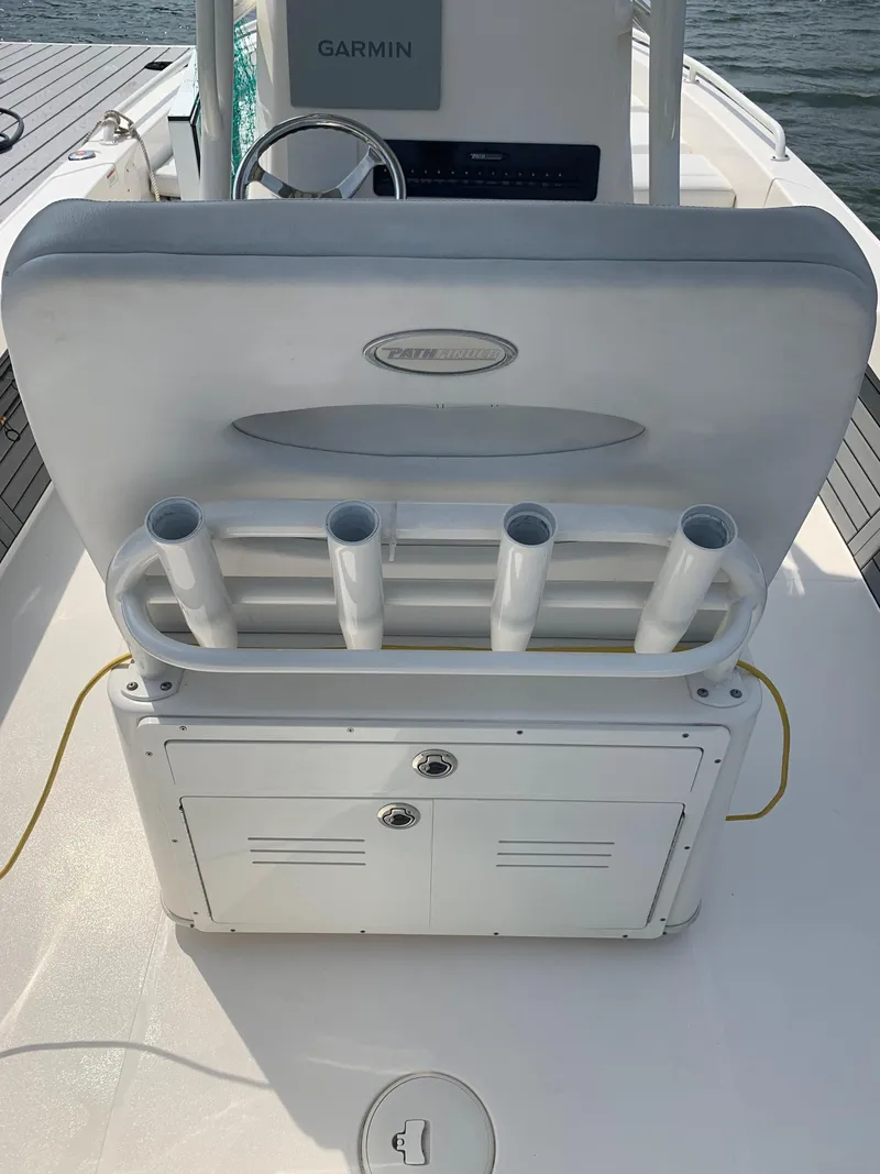 Slide: The Image of 2021 Pathfinder 2600 TRS boat interior with rod holders and Garmin equipment. - 23