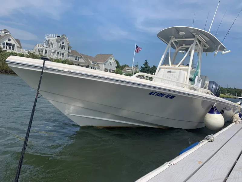 Slide: The Image of 2021 Pathfinder 2600 TRS boat docked near waterfront homes. - 28