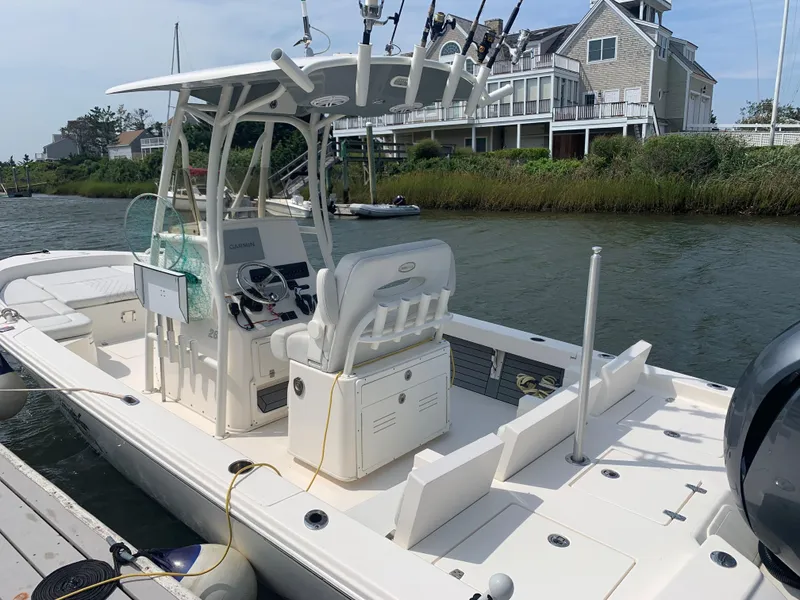 Slide: The Image of 2021 Pathfinder 2600 TRS boat docked by waterfront home. - 4