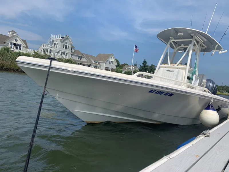 Slide: The Image of 2021 Pathfinder 2600 TRS boat docked near waterfront homes. - 5