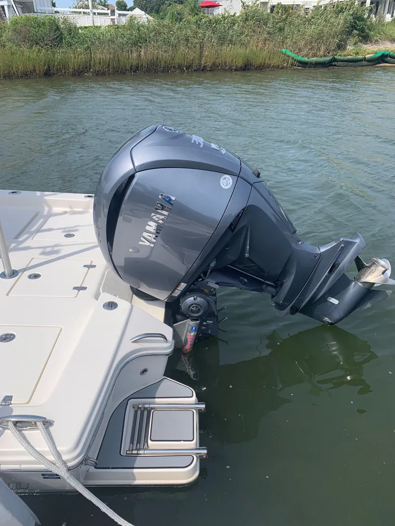 Slide: The Image of 2021 Pathfinder 2600 TRS boat with Yamaha outboard motor in water. - 8