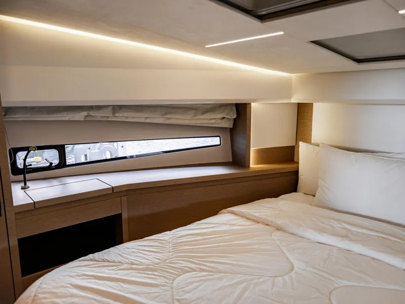 Slide: The Image of Luxurious bedroom interior of 2022 Prestige 460F yacht with modern lighting and cozy bedding. - 10