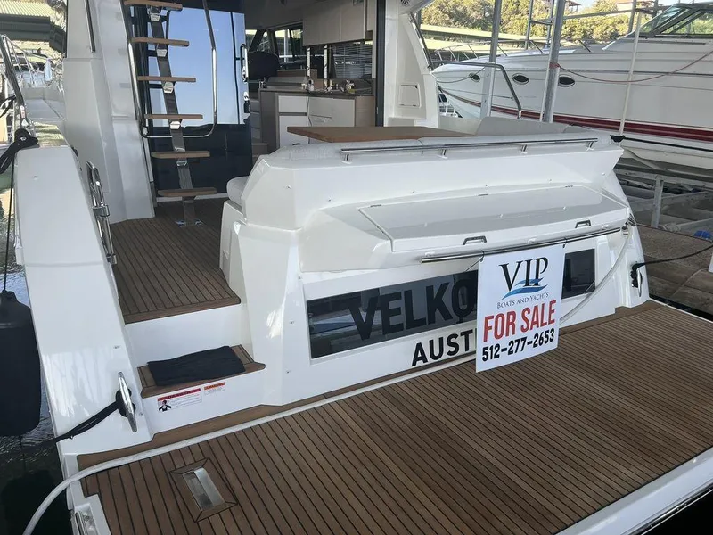 Slide: The Image of 2022 Prestige 460F yacht for sale, featuring spacious deck and modern design. - 18