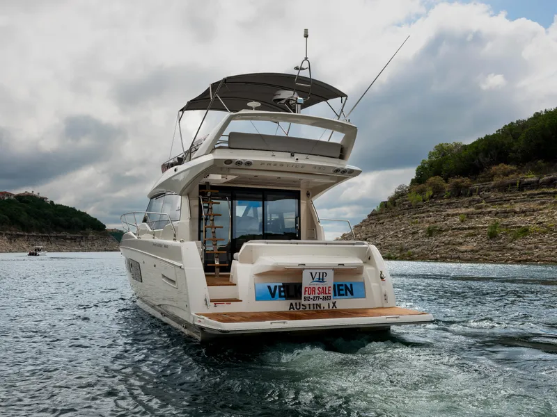 Slide: The Image of 2022 Prestige 460F yacht for sale on scenic lake in Austin, TX. - 2