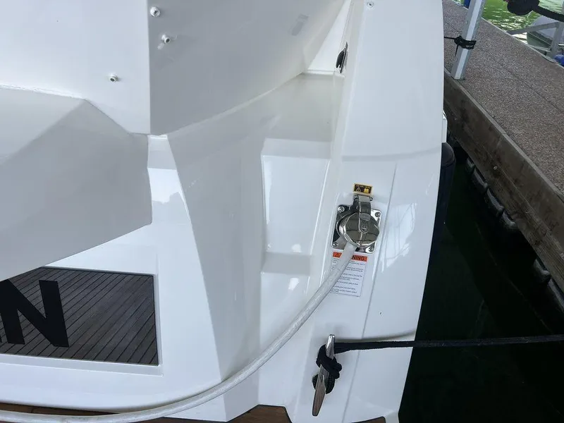 Slide: The Image of Prestige 460F 2022 yacht stern with fuel cap and mooring line. - 21