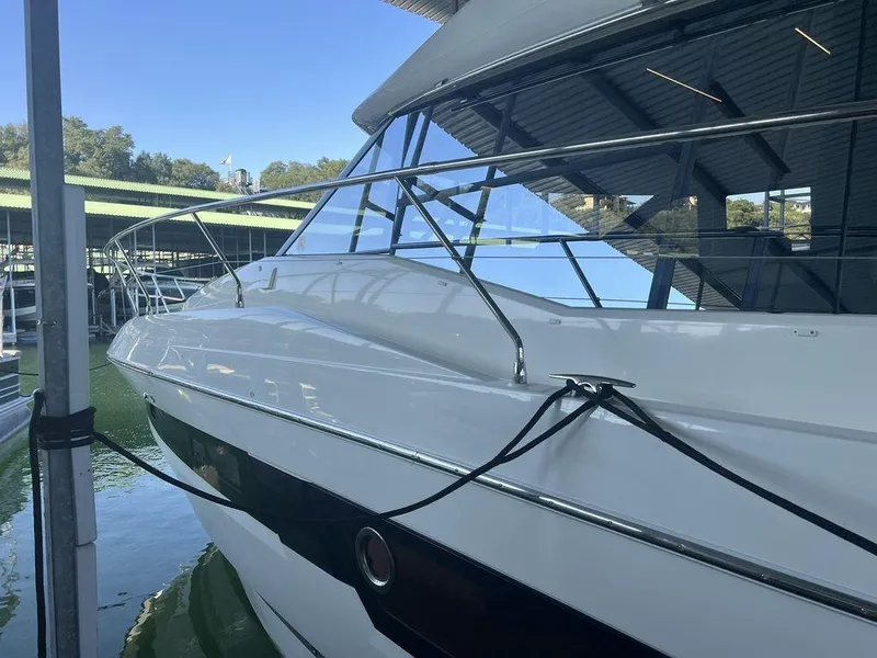 Slide: The Image of 2022 Prestige 460F yacht docked in marina, showcasing sleek design and modern features. - 24