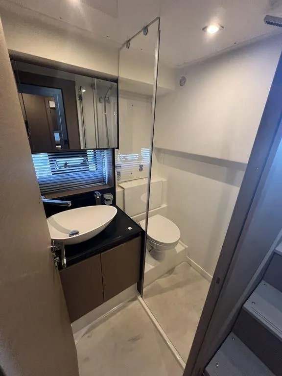 Slide: The Image of Modern bathroom in 2022 Prestige 460F yacht with sleek fixtures and elegant design. - 37