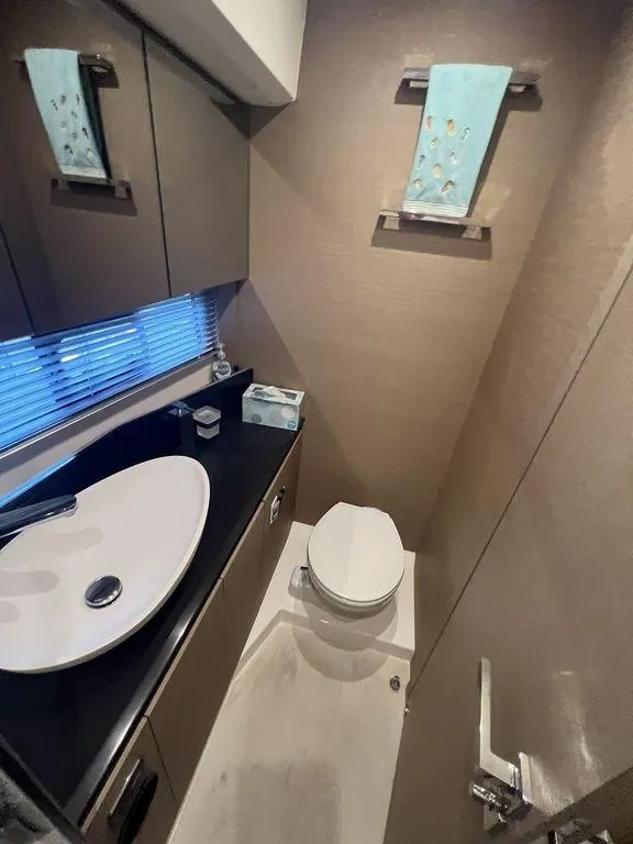 Slide: The Image of Modern bathroom in 2022 Prestige 460F yacht with sleek sink and toilet. - 40