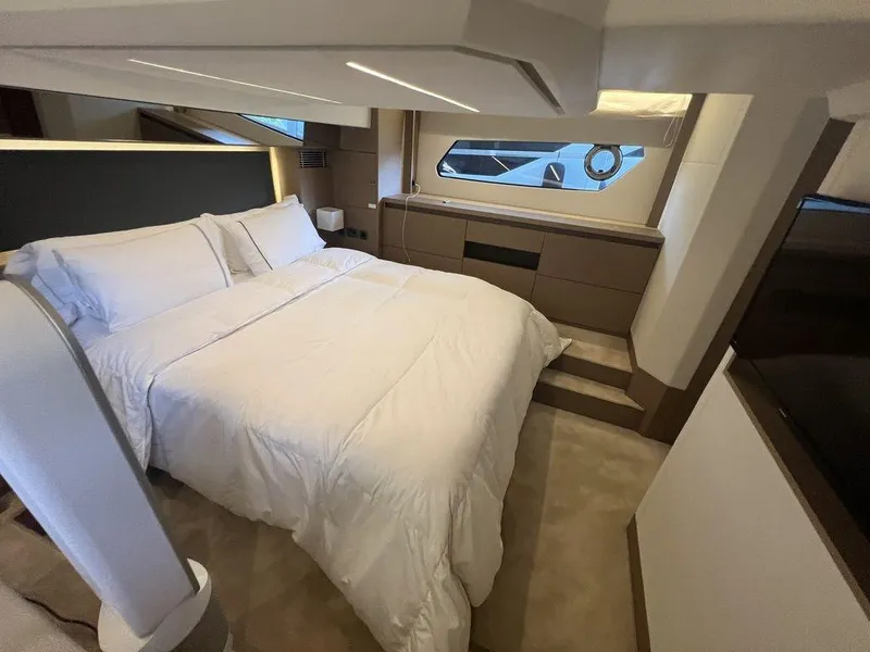 Slide: The Image of Luxurious bedroom interior of 2022 Prestige 460F yacht with modern design and cozy bedding. - 41