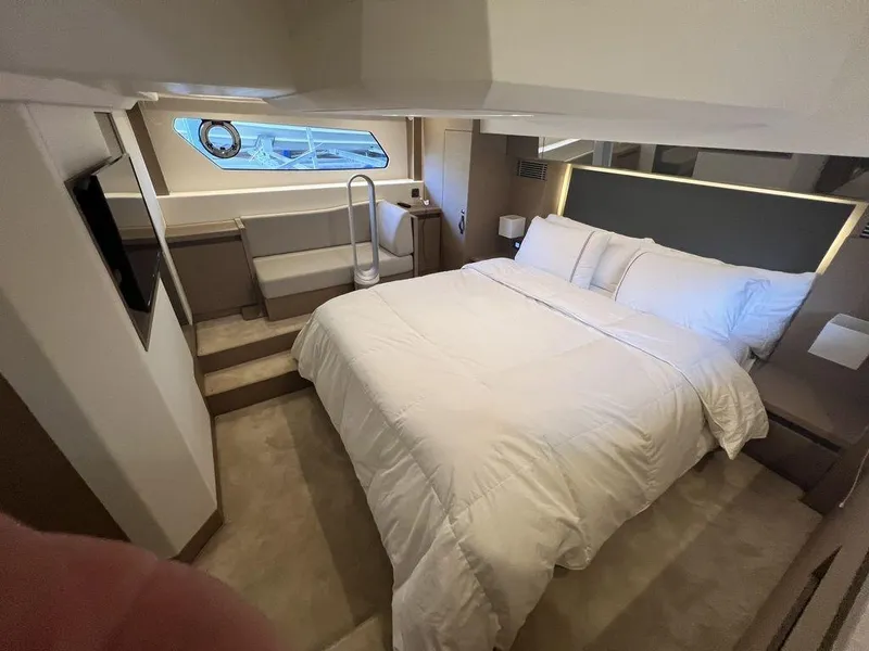 Slide: The Image of Luxurious bedroom interior of 2022 Prestige 460F yacht with modern design and cozy bedding. - 42