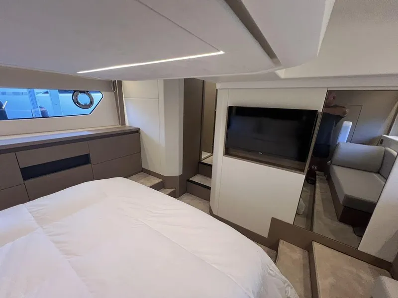 Slide: The Image of Luxurious interior of 2022 Prestige 460F yacht with modern bedroom and TV. - 44