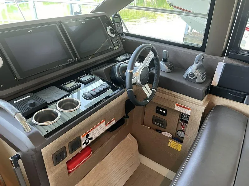 Slide: The Image of Prestige 460F 2022 yacht helm with modern controls and navigation screens. - 48