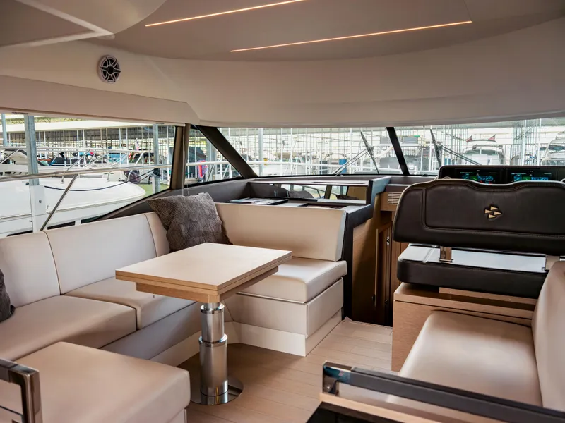 Slide: The Image of Luxurious interior of 2022 Prestige 460F yacht with modern seating and elegant design. - 6
