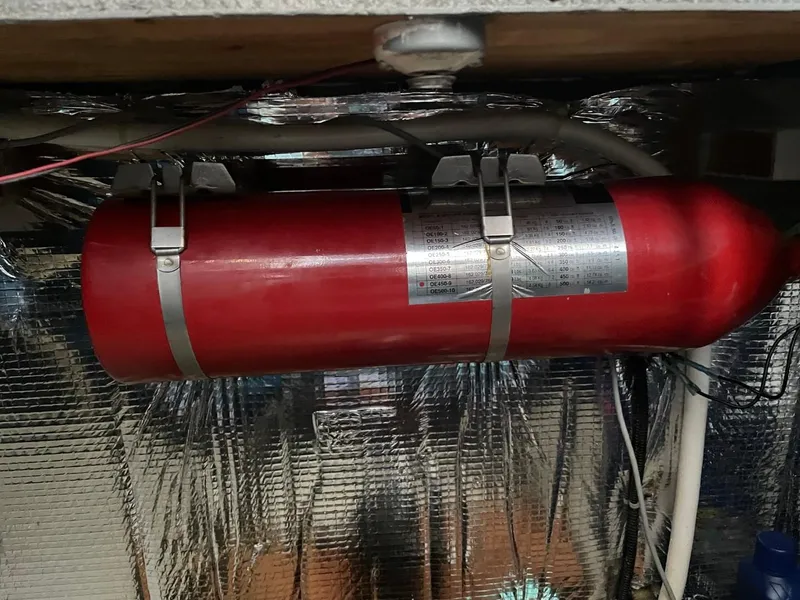 Slide: The Image of Red fire extinguisher in 1991 Silverton 41 Convertible engine room. - 13