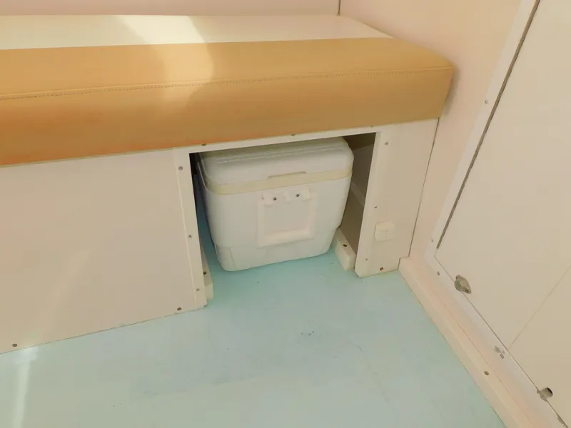 Slide: The Image of Steiger Craft 31 Miami 2016 interior with storage compartment and cooler. - 33