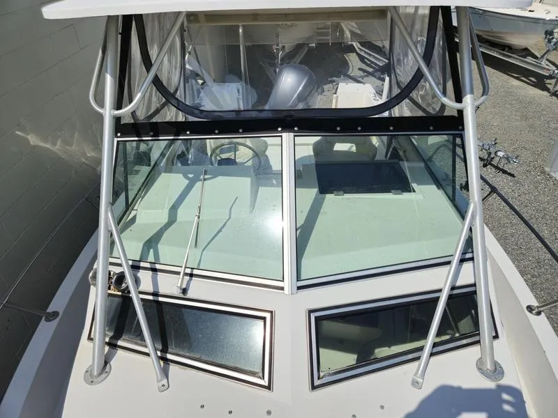 Slide: The Image of 1990 Grady-White 230 Gulfstream boat with windshield and canopy, viewed from above. - 21