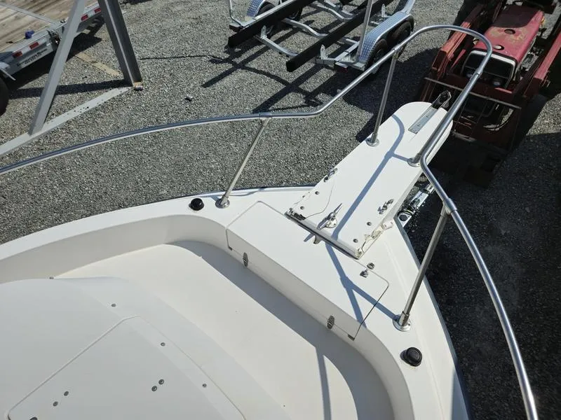 Slide: The Image of 1990 Grady-White 230 Gulfstream boat deck with railing and anchor mount. - 23