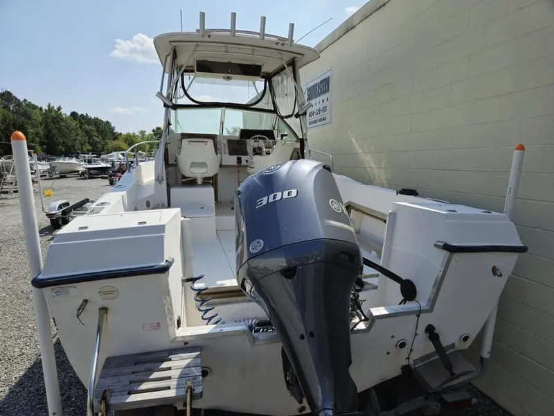 Slide: The Image of 1990 Grady-White 230 Gulfstream boat with powerful 300 HP engine, docked outdoors. - 5