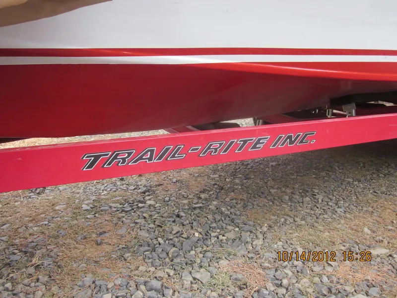 Slide: The Image of 1948 Chris-Craft Racer on Trail-Rite trailer, red hull, gravel ground, dated October 14, 2012. - 11